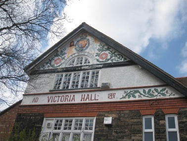 Floral friezes on top storey